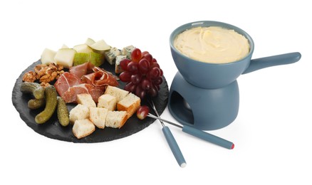 Photo of Fondue with tasty melted cheese, forks and different snacks isolated on white