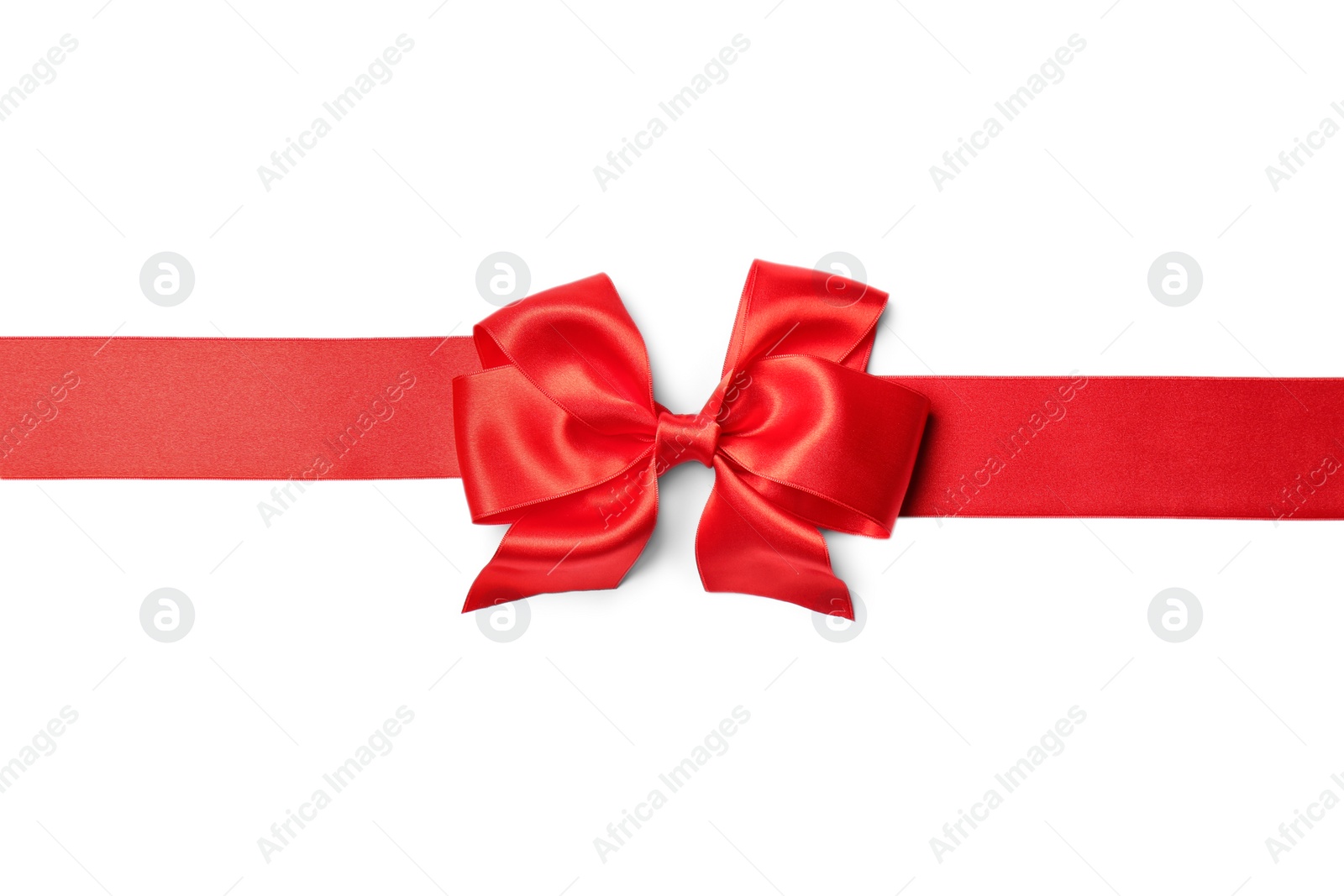 Photo of Red ribbon with bow on white background. Festive decoration