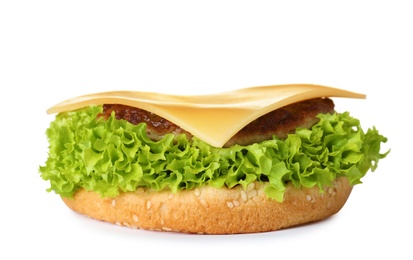 Photo of Burger bun with lettuce, cutlet and cheese isolated on white