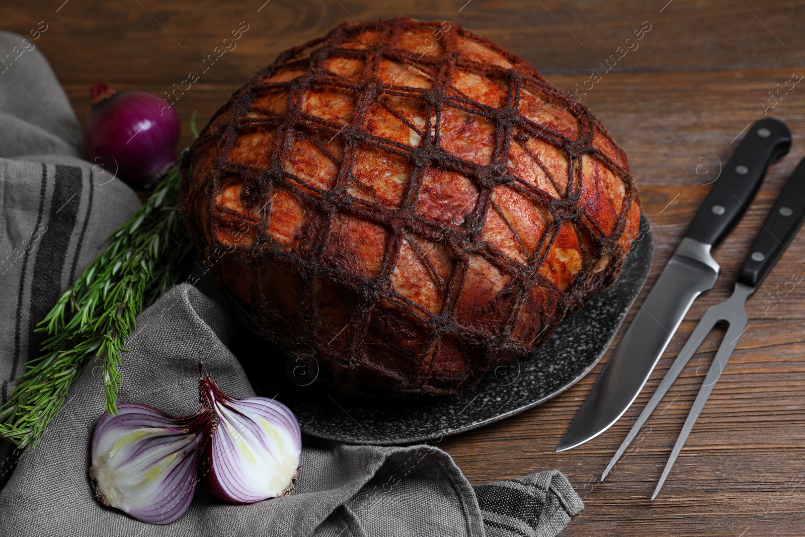 Photo of Delicious baked ham served on wooden table