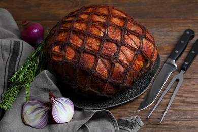 Delicious baked ham served on wooden table