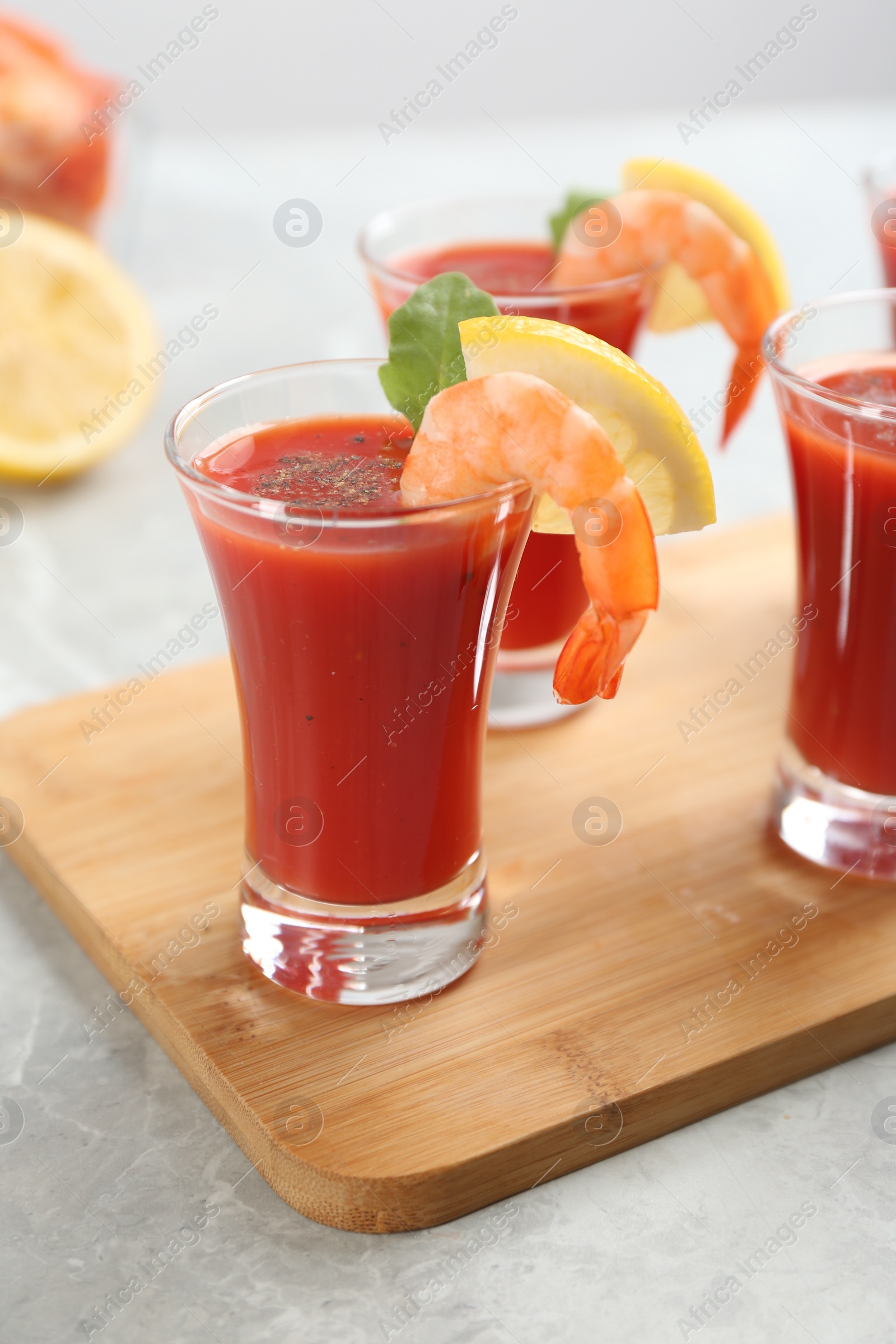 Photo of Delicious shrimp cocktail with tomato sauce served on  table