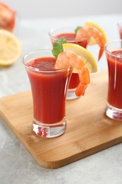 Photo of Delicious shrimp cocktail with tomato sauce served on  table