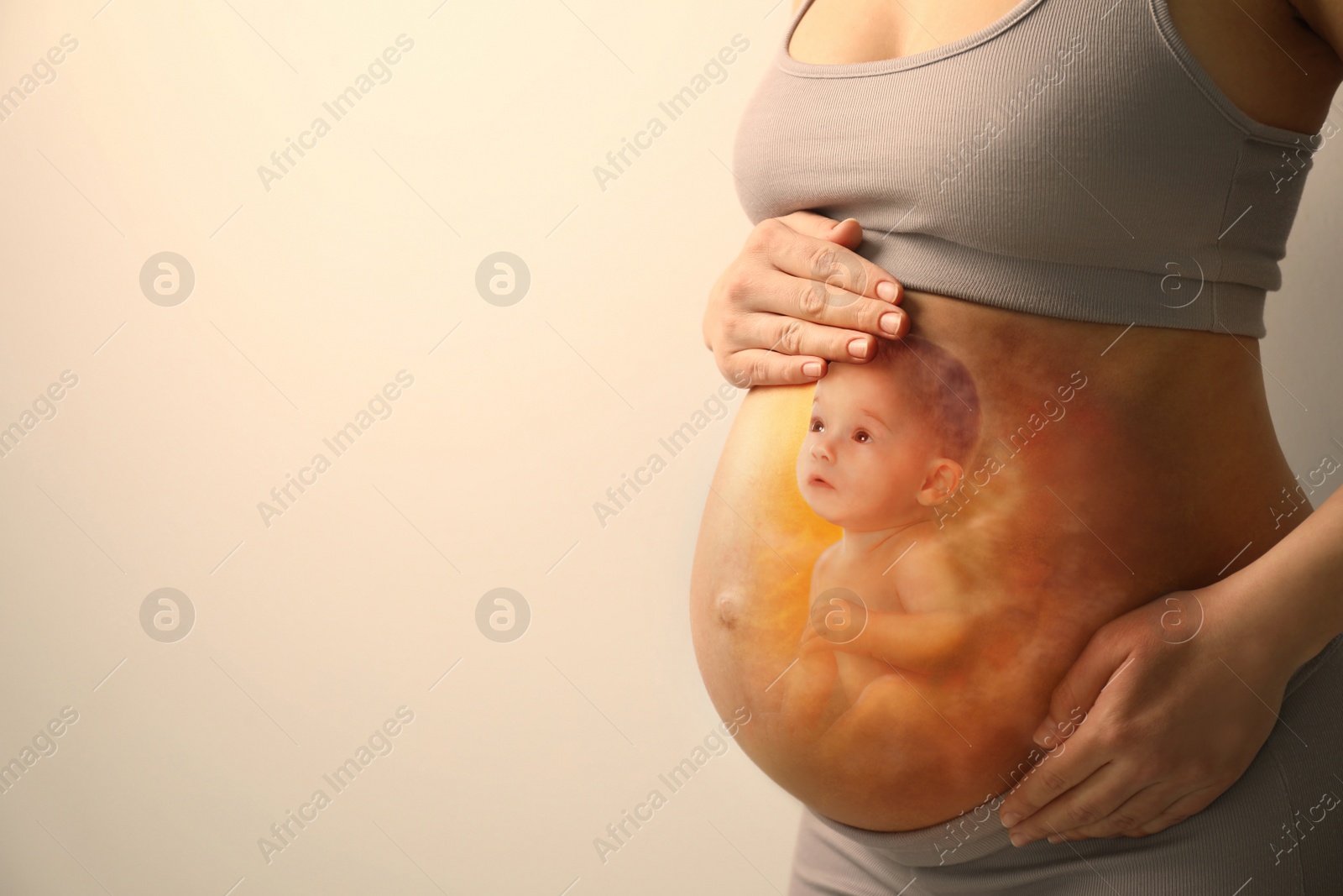 Image of Pregnant woman and baby on beige background, closeup view of belly. Double exposure