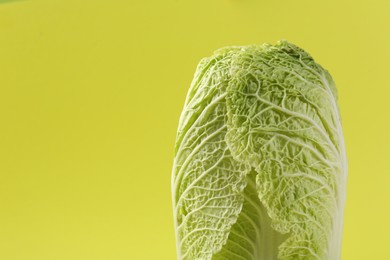 Photo of Fresh ripe Chinese cabbages on pale yellow background, closeup. Space for text