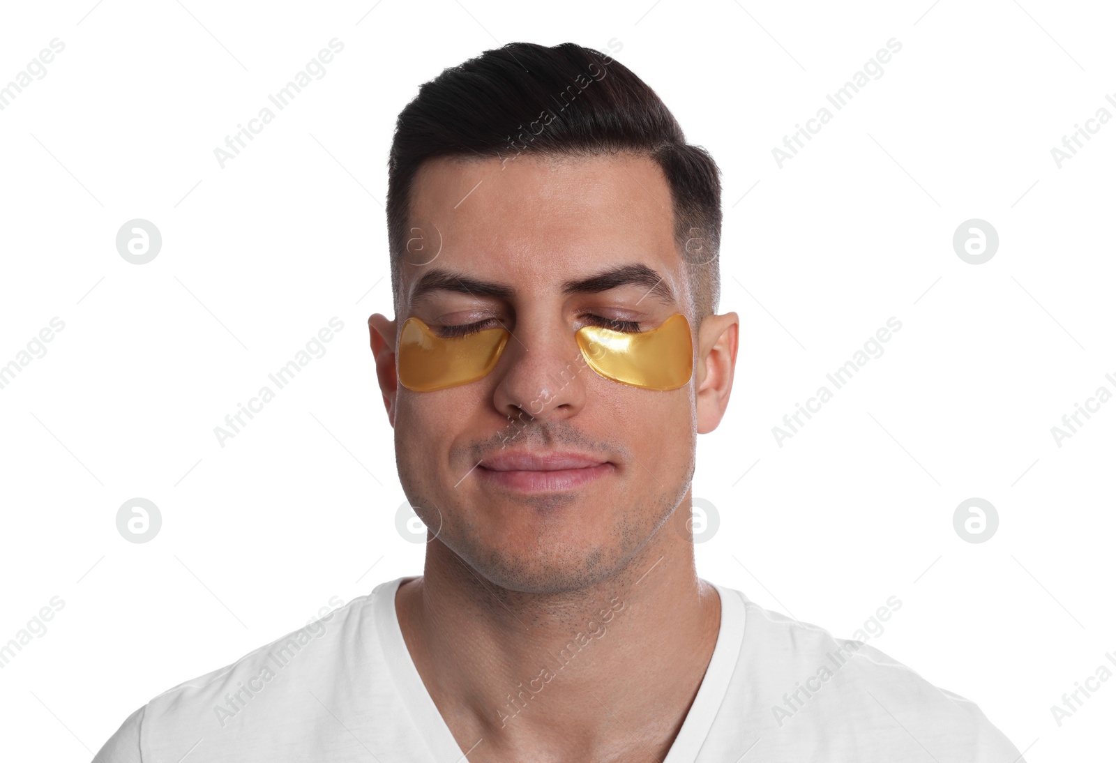 Photo of Man with golden under eye patches on white background