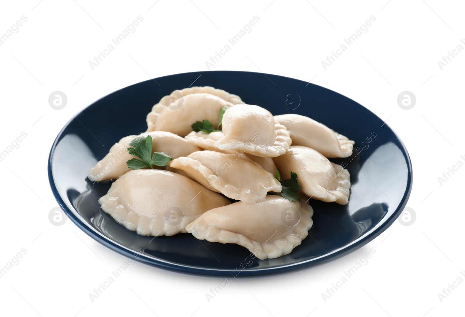 Photo of Plate of tasty dumplings served with parsley on white background