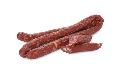 Photo of Thin dry smoked sausages isolated on white