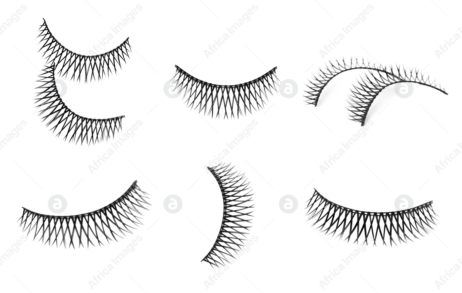 Image of Set with beautiful false eyelashes on white background