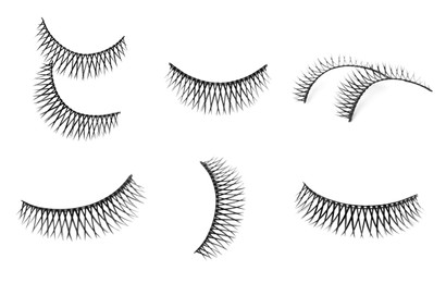 Image of Set with beautiful false eyelashes on white background