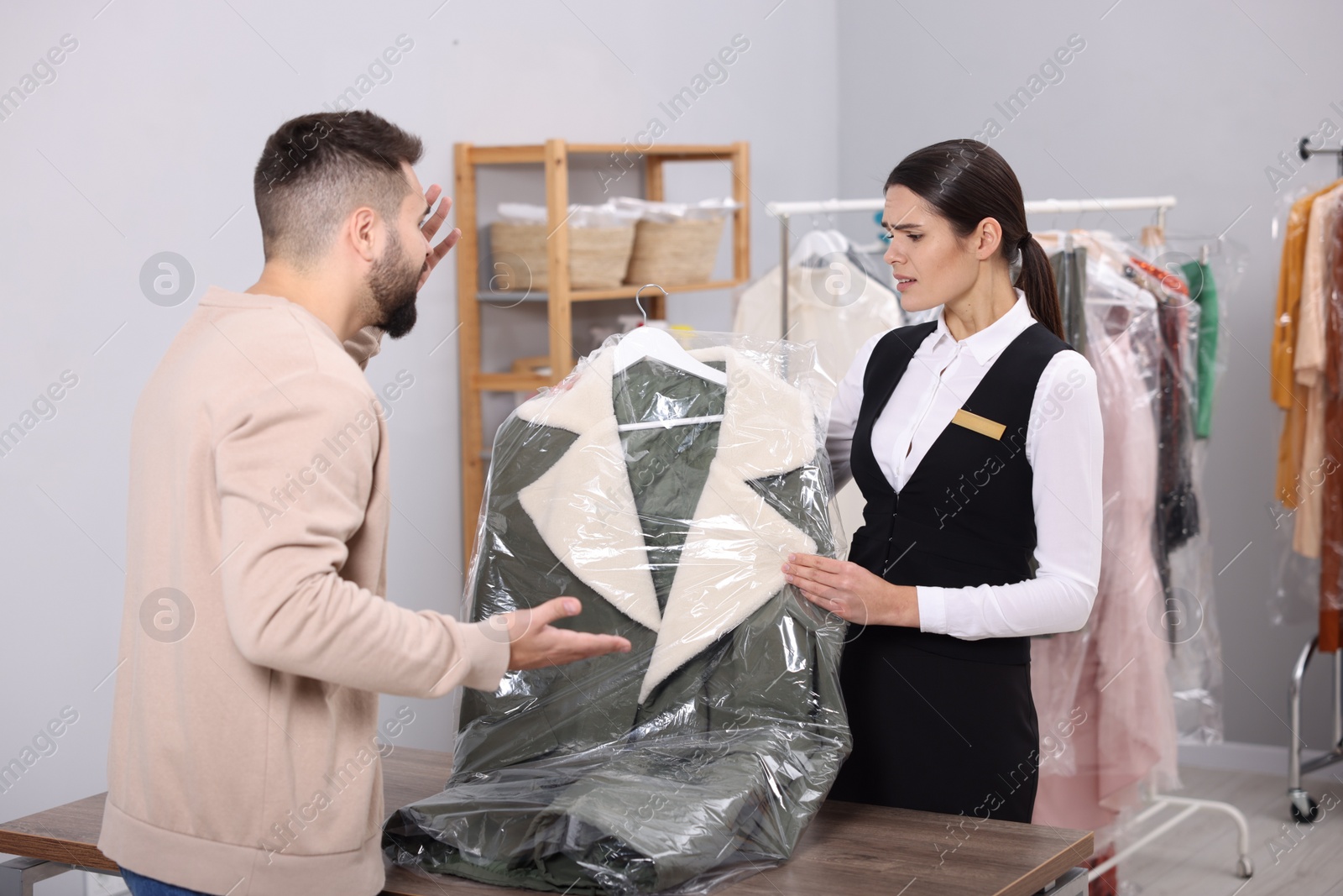 Photo of Client complaining about quality of service at dry cleaner's