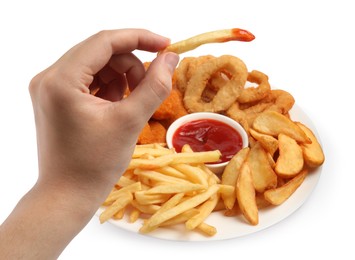 Photo of Woman holding delicious french fry with ketchup and different snacks on white background, closeup