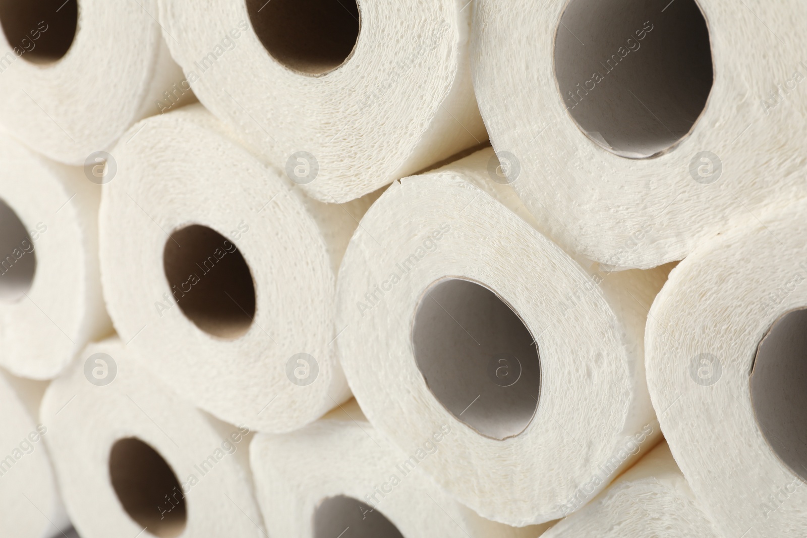 Photo of Rolls of paper towels as background, closeup view