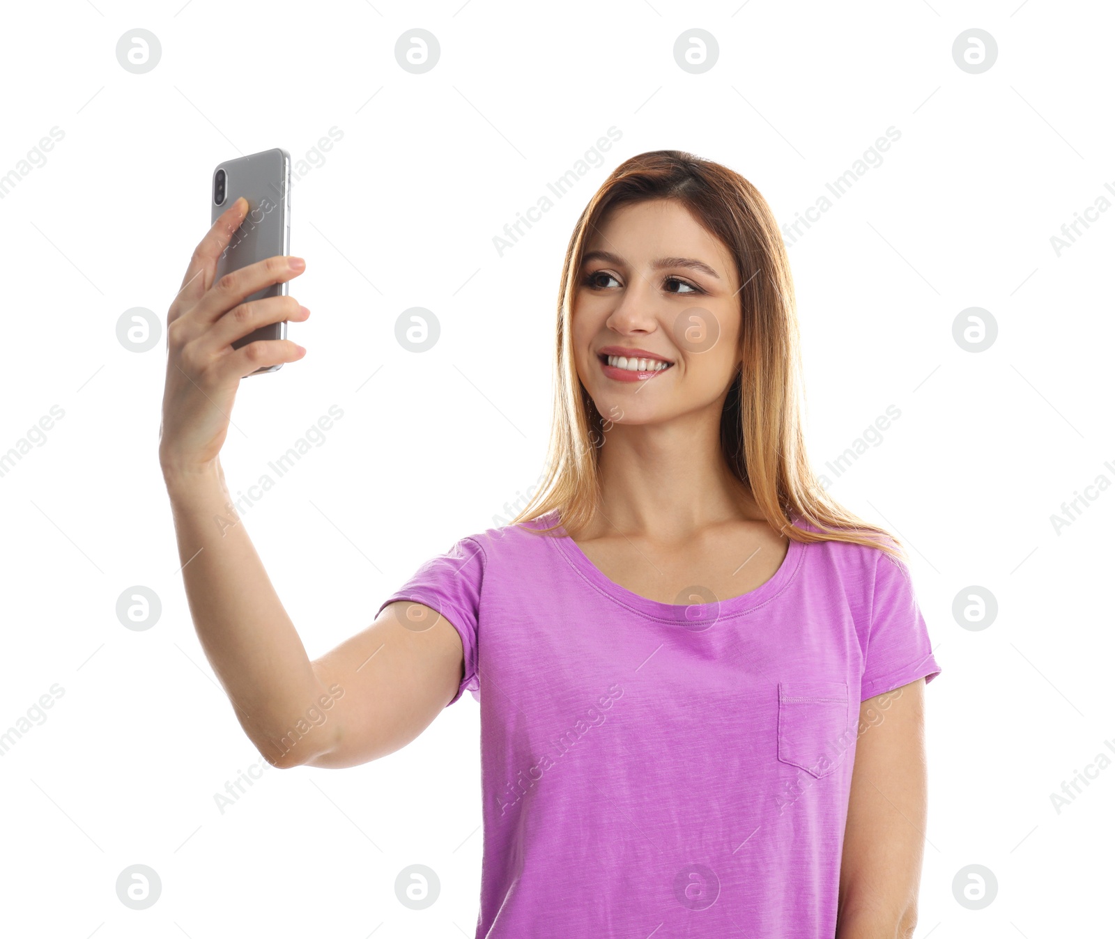 Photo of Young woman taking selfie on white background