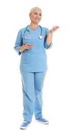 Photo of Full length portrait of female doctor in scrubs isolated on white. Medical staff