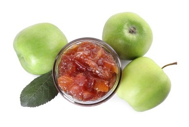 Photo of Glass jar of delicious apple jam and fresh fruits isolated on white, top view