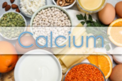 Image of Different fresh products with high amounts of easily absorbable calcium on table, flat lay
