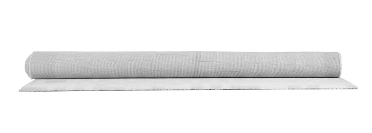 Rolled soft carpet on white background. Interior element