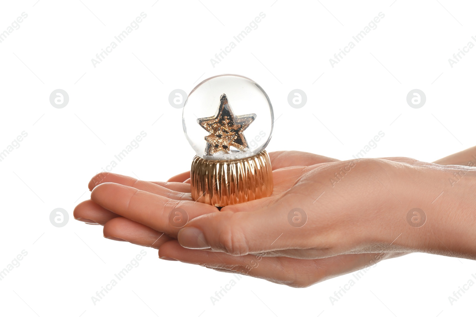 Photo of Woman holding beautiful snow globe on white background, closeup