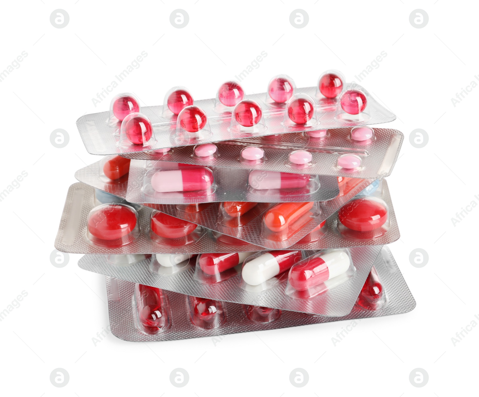 Photo of Stack of blisters with different pills on white background