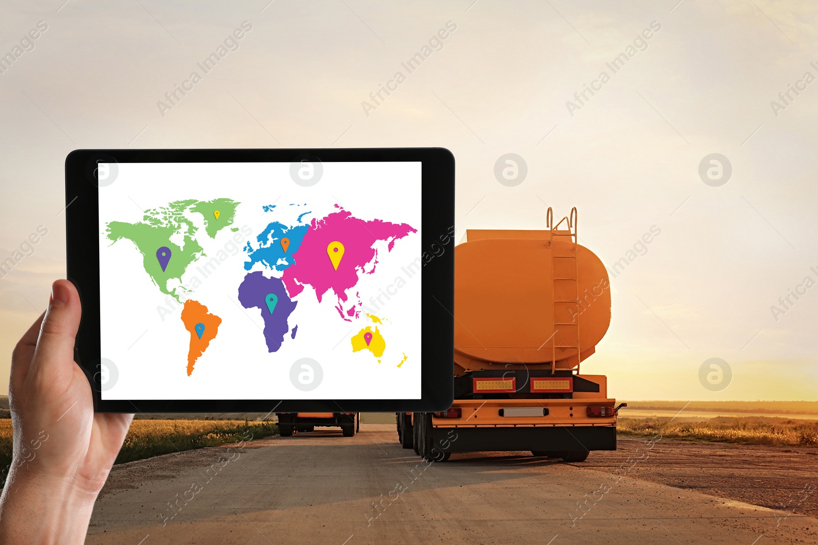 Image of Logistics concept. Woman using tablet with world map on screen against truck