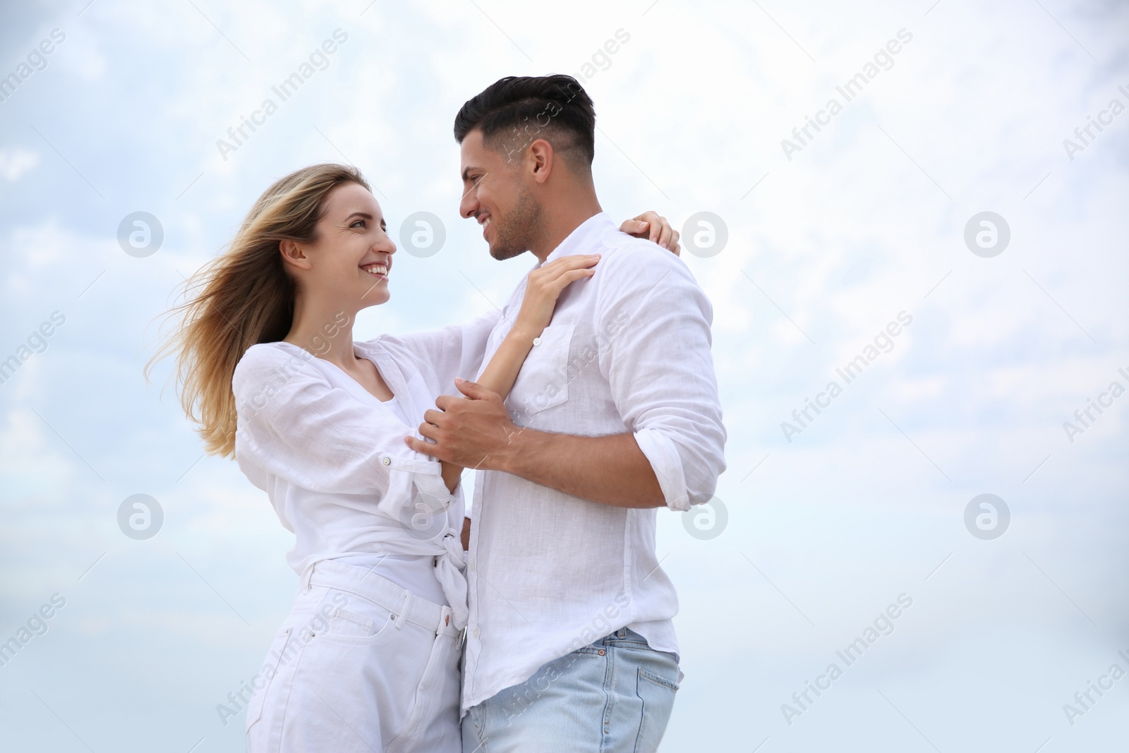 Photo of Happy couple on beach, space for text. Romantic walk