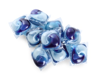 Heap of laundry capsules on white background, top view