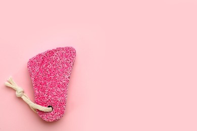 Photo of Color pumice stone on pink background, top view. Space for text