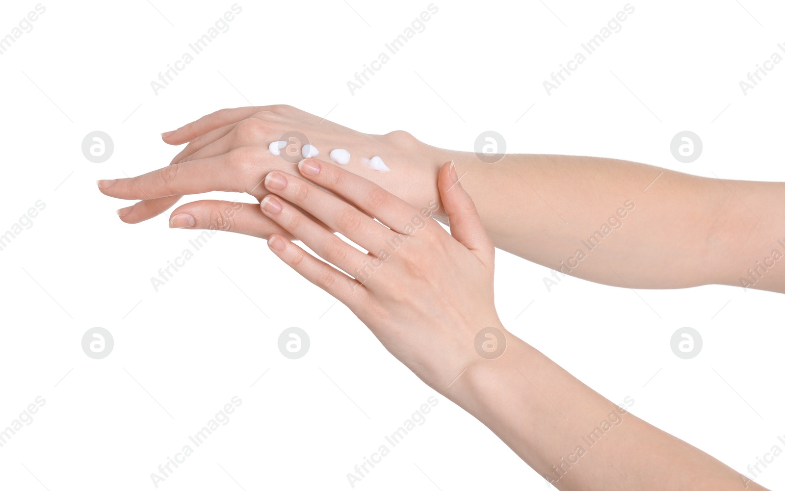 Photo of Young woman applying hand cream on white background