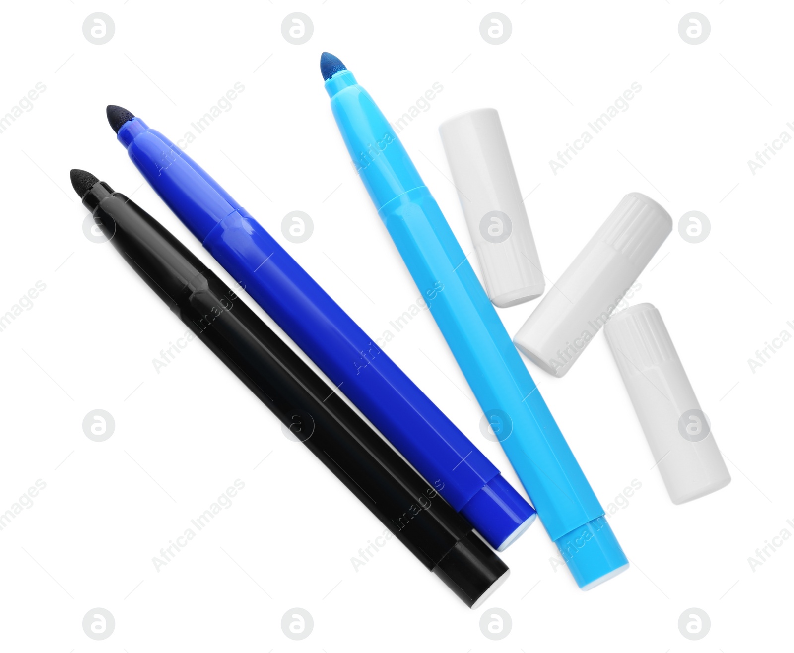 Photo of Different colorful markers and caps on white background, top view