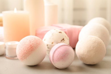 Photo of Different bath bombs on table. Spa products