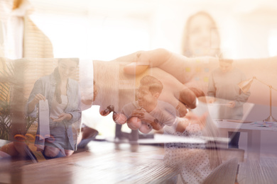 Double exposure of team workers and business partners shaking hands in office, closeup 