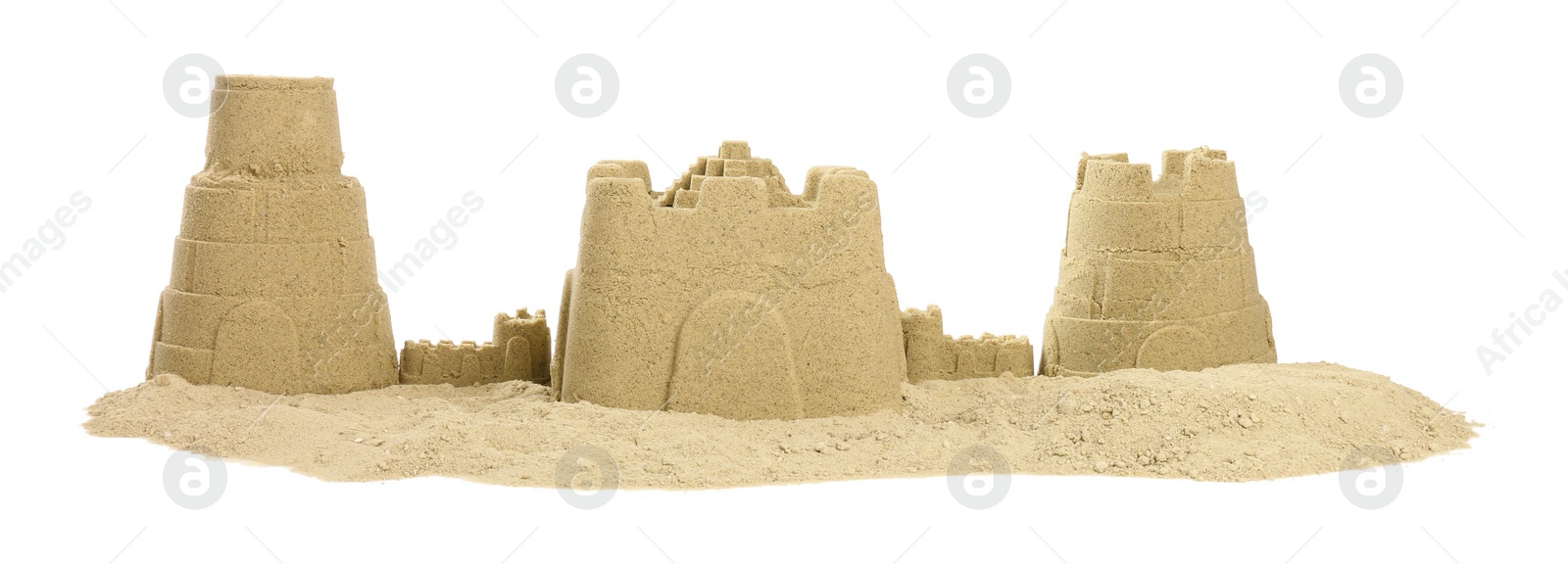 Photo of Pile of sand with beautiful castles isolated on white