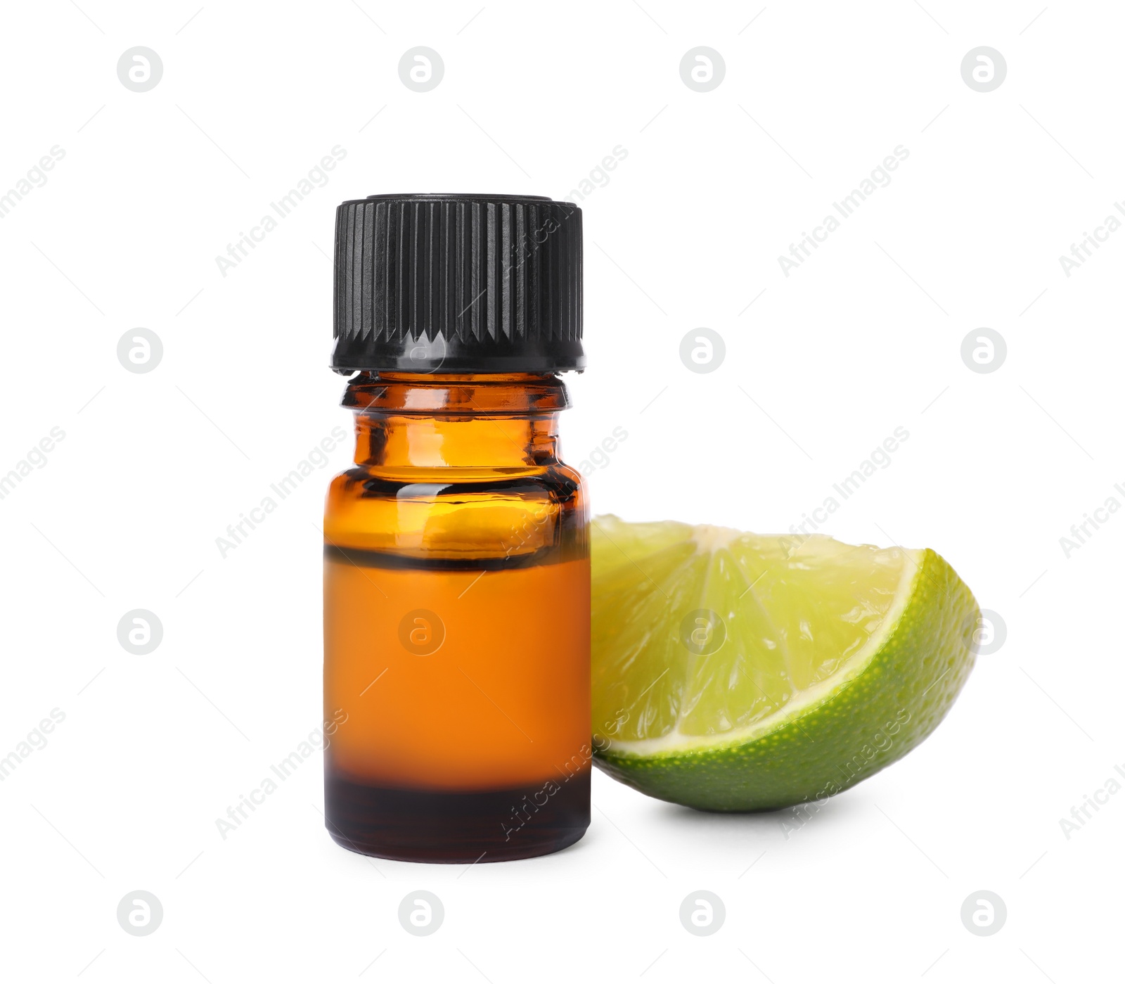 Photo of Bottle of citrus essential oil and cut fresh lime isolated on white