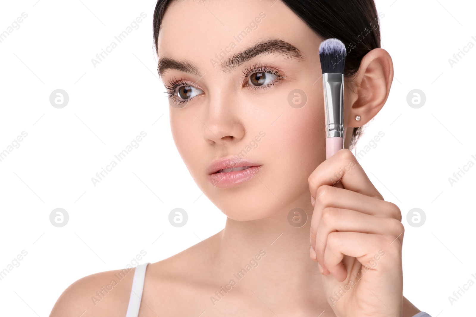 Photo of Teenage girl with makeup brush on white background