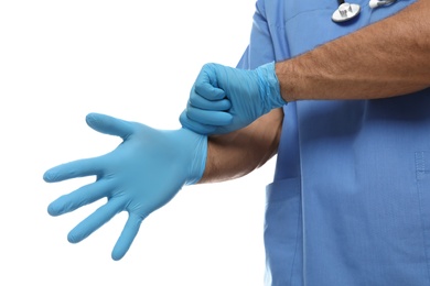 Photo of Doctor putting on medical gloves against white background, closeup