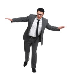 Businessman in suit posing on white background