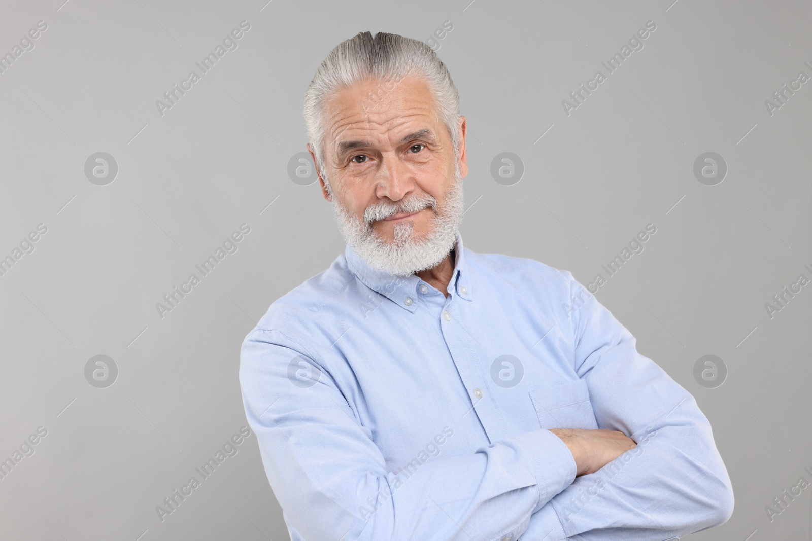 Photo of Portrait of handsome senior man on light grey background