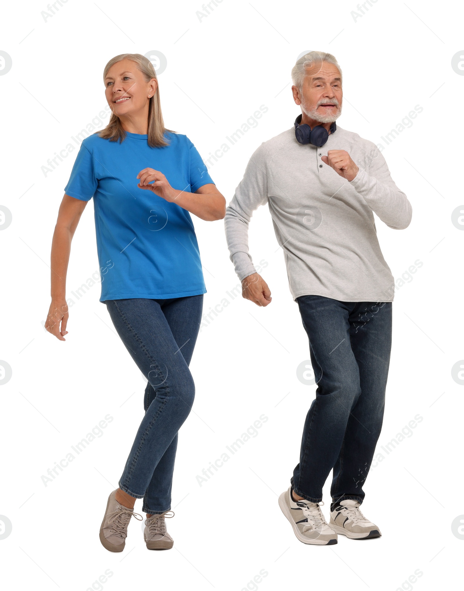 Photo of Senior couple dancing together on white background