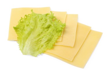 Slices of tasty fresh cheese and lettuce isolated on white, top view