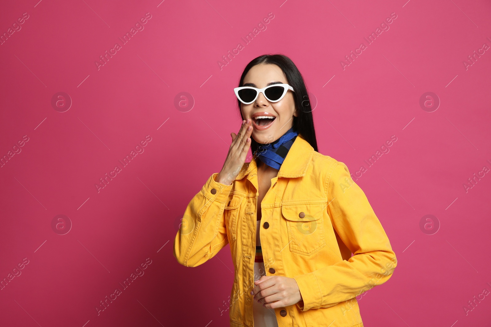 Photo of Fashionable young woman in stylish outfit with bandana on pink background, space for text