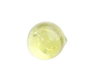 Photo of Drop of yellow ointment on white background, top view