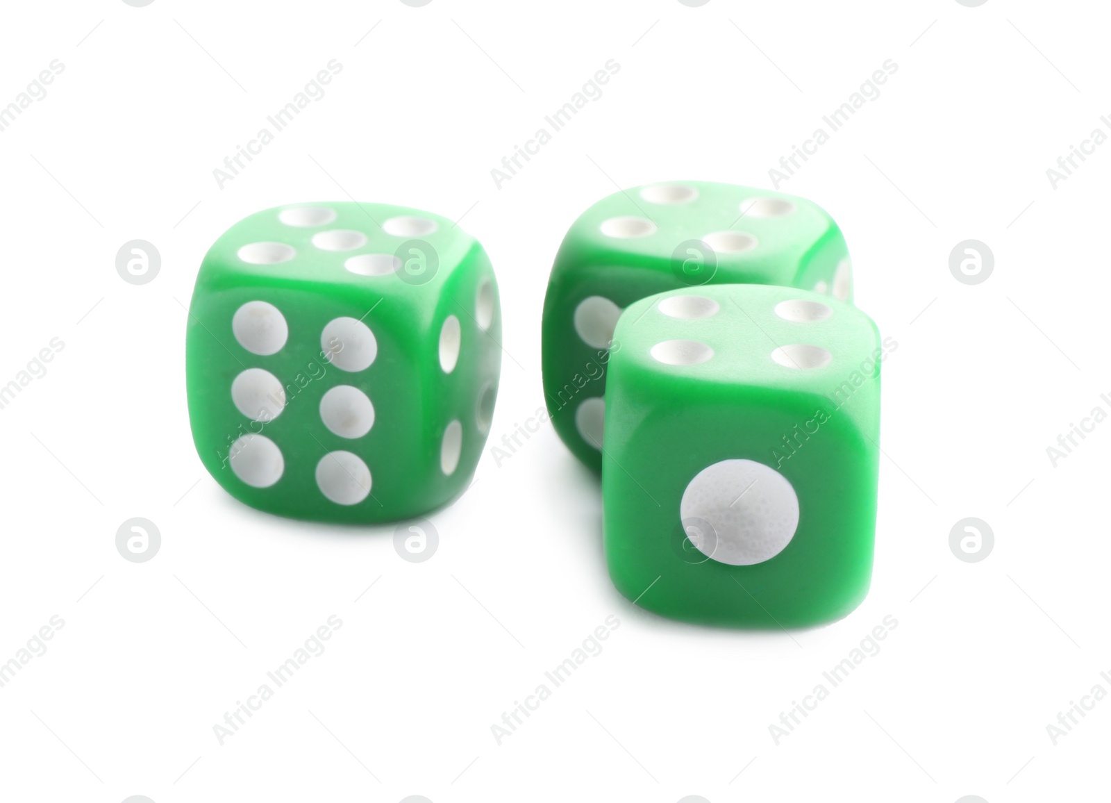 Photo of Three green game dices isolated on white