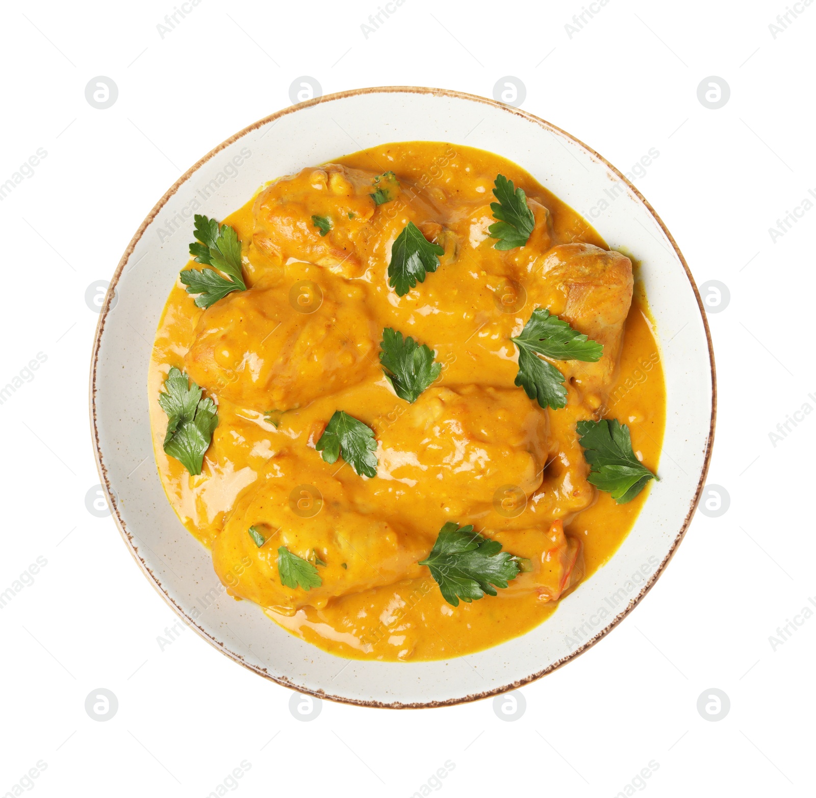 Photo of Tasty chicken curry with parsley isolated on white, top view