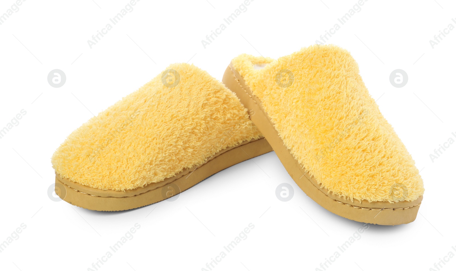 Photo of Pair of yellow soft slippers isolated on white