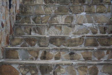 Photo of View of empty concrete staircase with stone fragments outdoors