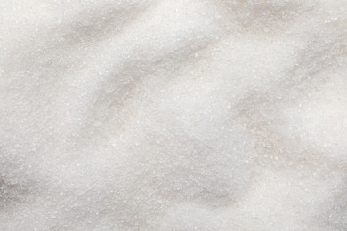 Sweet granulated sugar as background, top view