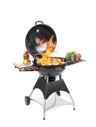 Image of Flaming barbecue grill with cooking meal on white background