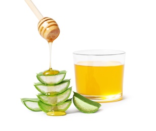 Photo of Pouring honey onto aloe vera on white background