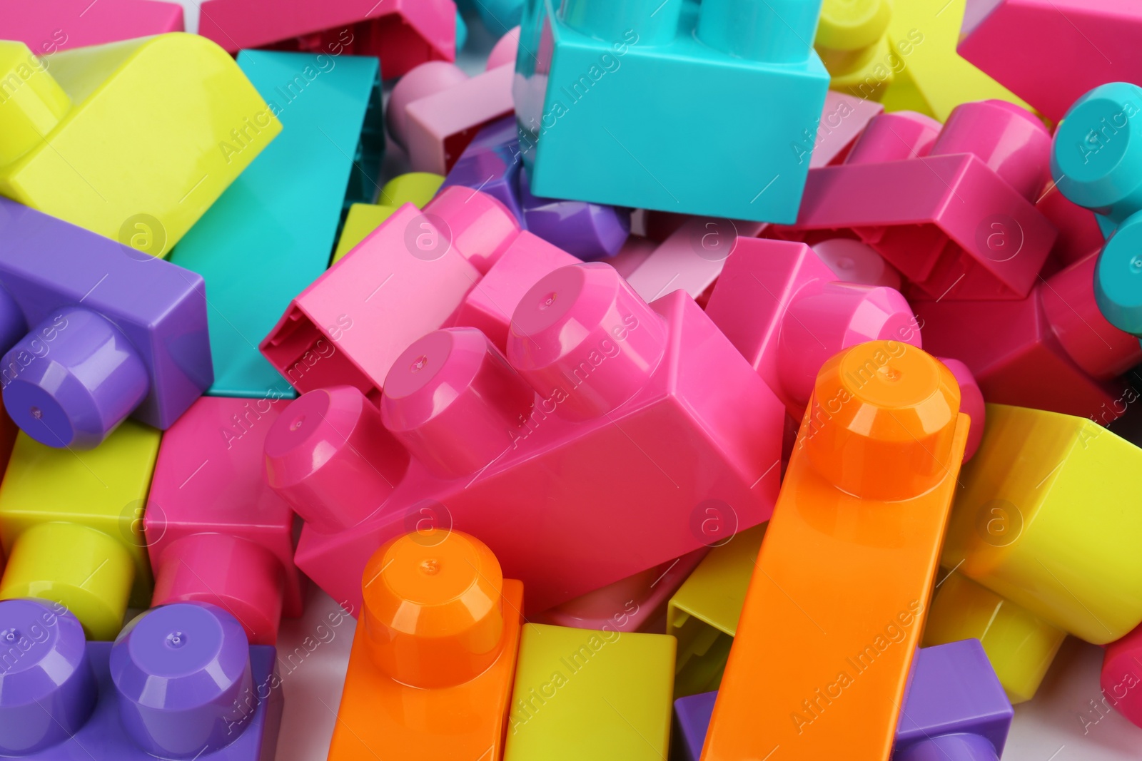 Photo of Colorful blocks as background, closeup. Children's toys